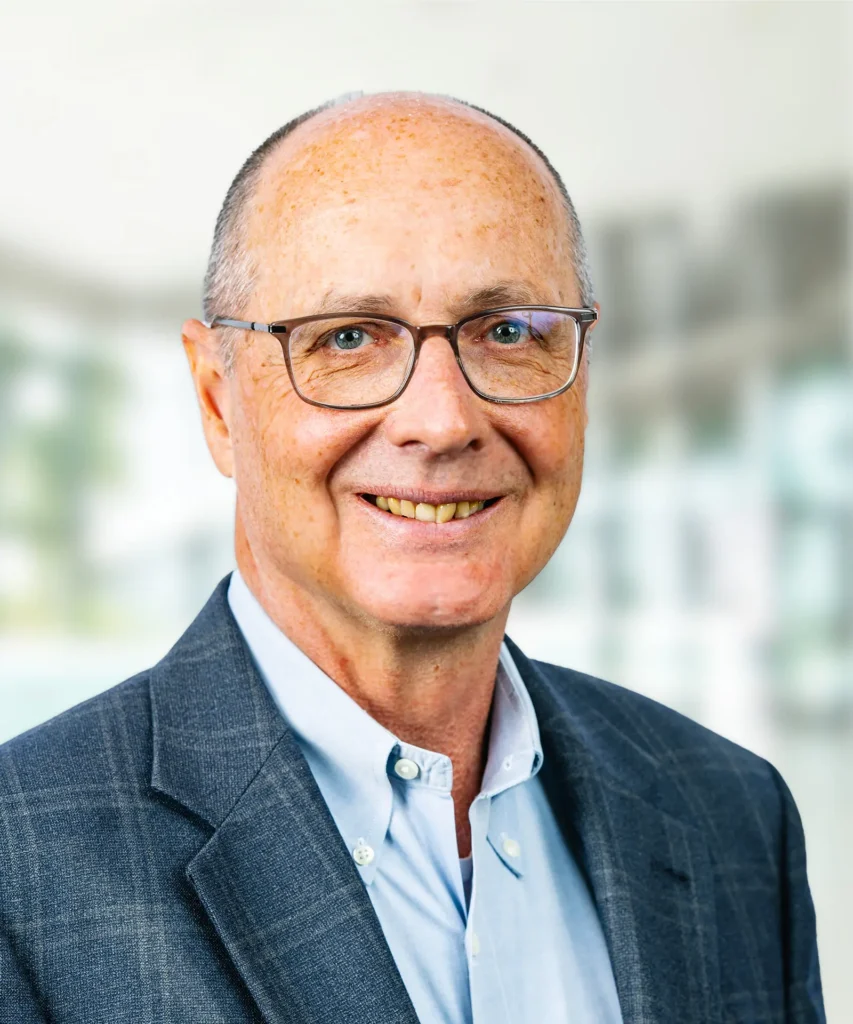 A headshot of Michael Rowe.