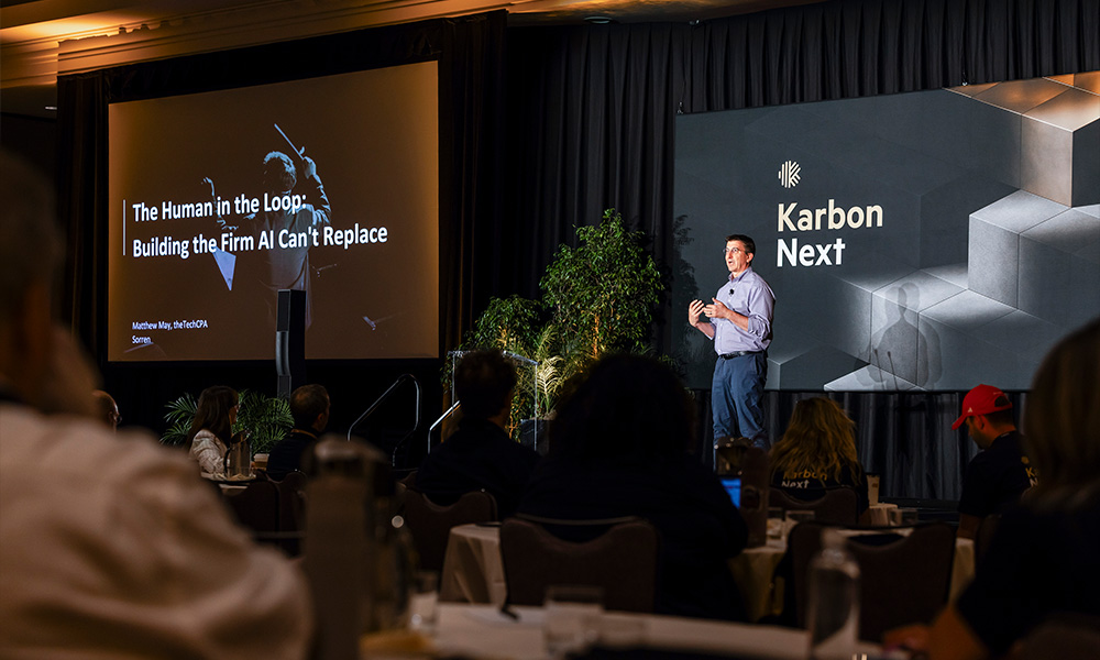 Matthew May presenting his keynote "The Human in the Loop: Building the Firm AI Can't Replace" at the Karbon Next conference.