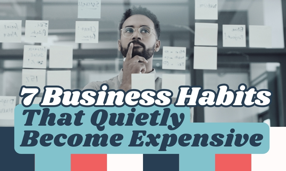 Thoughtful businessman standing behind a glass wall filled with sticky notes, overlaid with the text "7 Business Habits That Quietly Become Expensive".